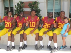 D.J. Morgan, Marqise Lee, Hayes Pullard, Silas Redd, Xavier Grimble, and young fan